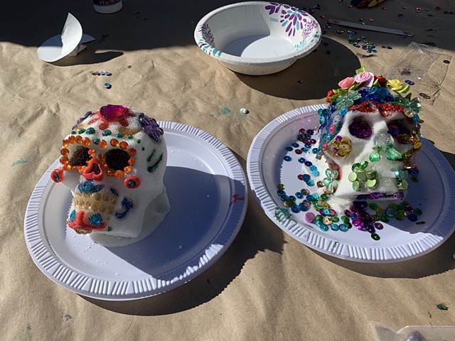 Sugar skulls decorated by family units.