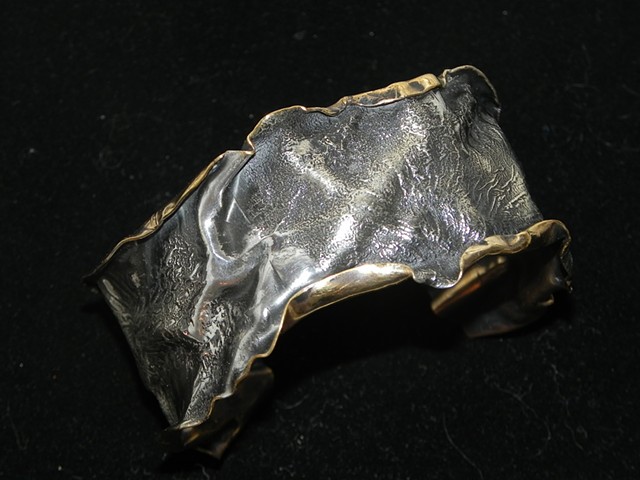 Reticulated 1/10 silver plate on Brass. Fold formed cuff