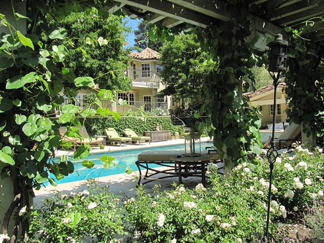 View of pool from shady side of pool , main house beyond