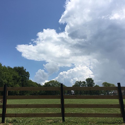 Great summer cloud build up over our new fence!