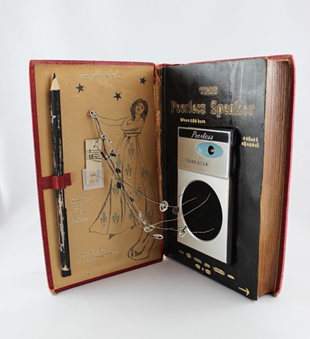found book sculpture, found object art, transistor radio, oracle