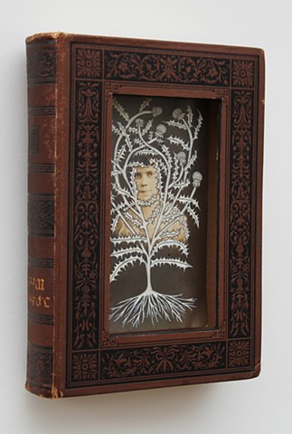 "Thistle Woman", by Lesley Patterson-Marx: found book sculpture, drawing on found photograph