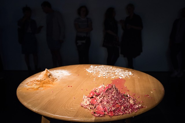 Installation documentation of material traces left following performance 'Bite Your Tongue' (viewers looking on at material detritus) 