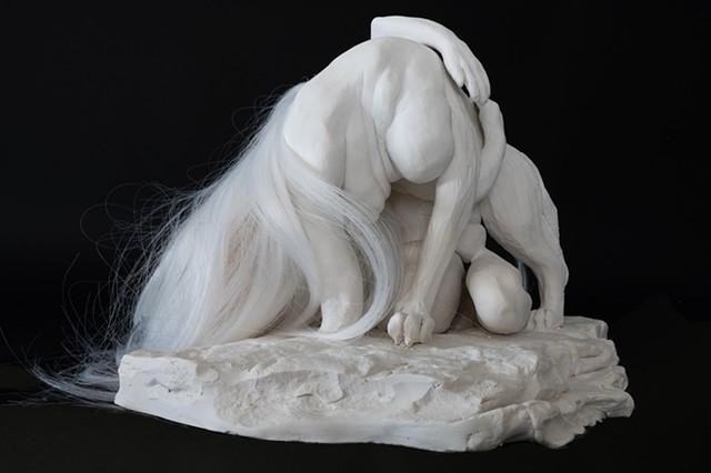 Clay sculpture of wolf woman and hair