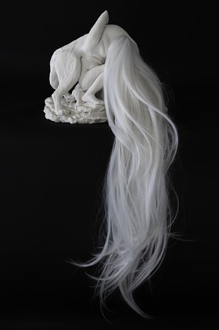 Clay sculpture of wolf woman and hair