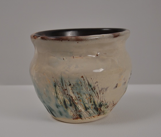 almond and rust colored glazes on an oblong vase