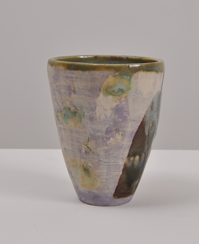ceramic cup with lavender, green, and blue glaze