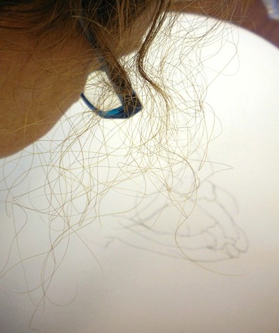 Working on a stitched hair piece, February 
