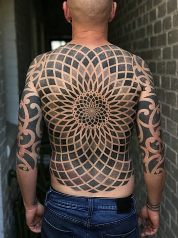 Back piece geometric mandala by Alvaro Flores Tattooer from La Flor Sagrada Tattoo Melbourne Australia