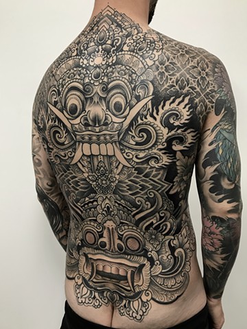 Balinese mask tattoo and geometric ornamental patterns back piece by Alvaro Flores Tattooer from La Flor Sagrada Tattoo in Melbourne Australia