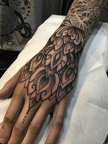 Thai style hand tattoo from Alvaro Flores done at The London Tattoo Convention 2017