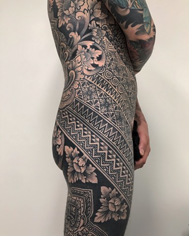 Ornamental floral and pattern bodysuit in progress by Alvaro Flores Tattooer from La Flor Sagrada Tattoo Melbourne Australia