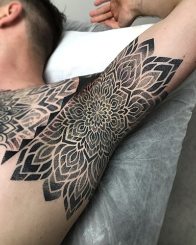 Geometric dotwork mandala armpit tattoo by Alvaro Flores Tattooer at La Flor Sagrada Tattoo Melbourne