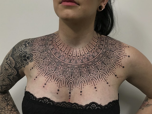 Fine line ornamental female collar tattoo by Alvaro Flores Tattooer from La Flor Sagrada Tattoo Melbourne Australia