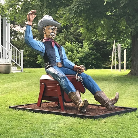 Buckaroo, cowboy, rodeo, bucking bronco, outdoor sculpture.
