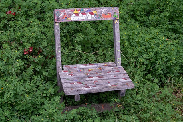 Weathered Chair In Garden
