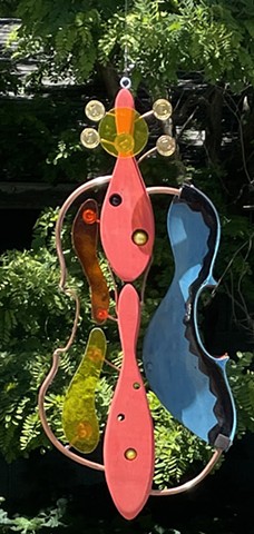 Stained glass violin hanging sculpture. 