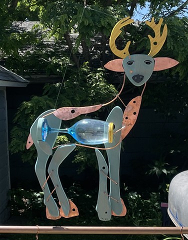 Hanging deer sculpture.