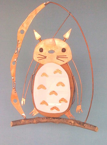 A hanging Totoro sculpture. 
