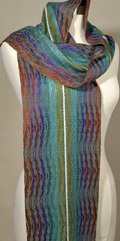 Handwoven scarf in turned extended summer and winter. Warp inspired by Isle of Skye tartan.