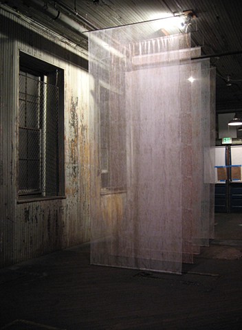 Installation with silkscreen on silk organza, ¼” steel rod 