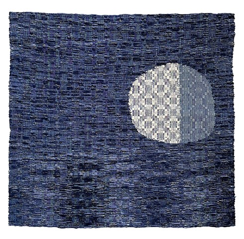 velvety night time weaving with moon rising from the darkness