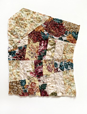 Quilt collage with mismatched floral piece work