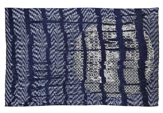 Overshot woven moon trapped behind a glitchy digital fence cage