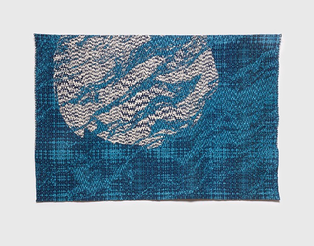 Distorted moon rippled by the surface of the water.  Woven with traditional Overshot and Crakle patterns