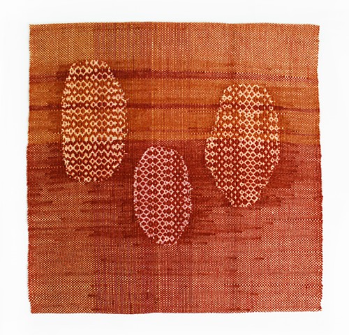 naturally dyed weaving of three individual oval "pebbles"