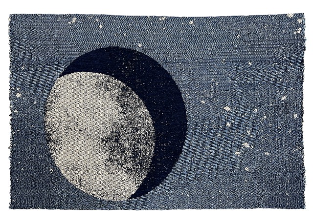 Waining cresent moon depicted on textural stary background