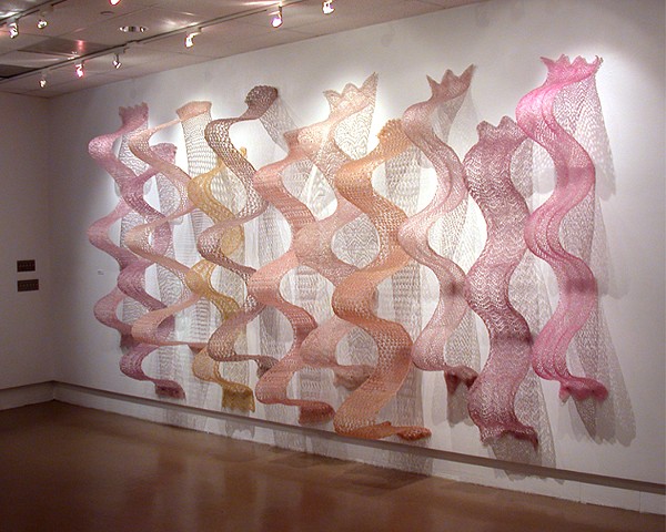 Crocheted fiberglass wall sculpture in S-curves by Yvette Kaiser Smith