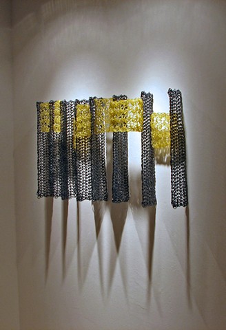 Minimal geometric crocheted fiberglass and polyester resin wall sculpture based on Pi by Yvette Kaiser Smith