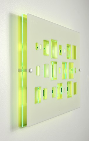 Green and white laser-cut acrylic template with geometric pattern based on pi by Yvette Kaiser Smith