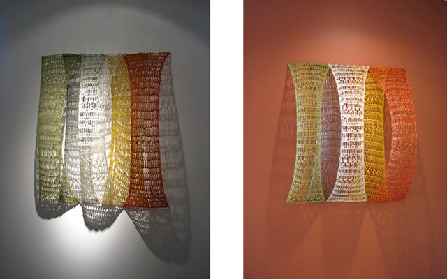 Minimal geometric crocheted fiberglass and polyester resin wall sculpture based on Pi by Yvette Kaiser Smith