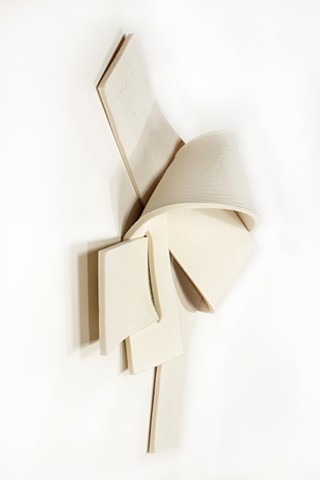 2 straps of thick off-white felt knotted together in chaotic manner