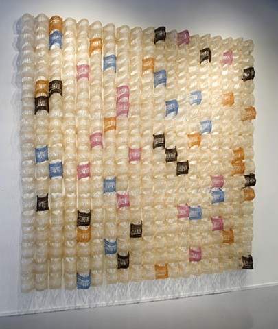 Geometric grid crocheted fiberglass and polyester resin wall sculpture based on the number e by Yvette Kaiser Smith