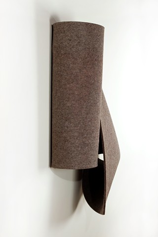 Simple folded 3D form in warm grey industrial felt