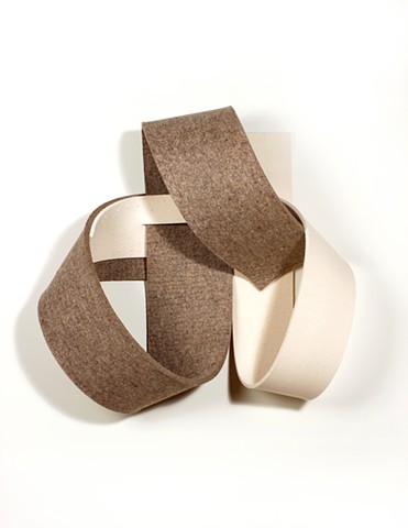 off-white and brown felt straps looped together