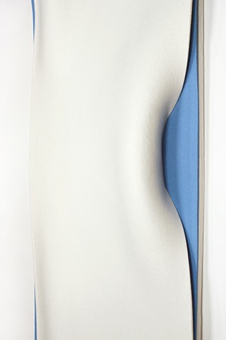 vertical organic undulating white felt revealing parts of light blue felt underneath