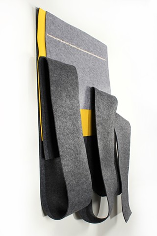 Dark grey with yellow industrial felt wall sculpture by Yvette Kaiser Smith