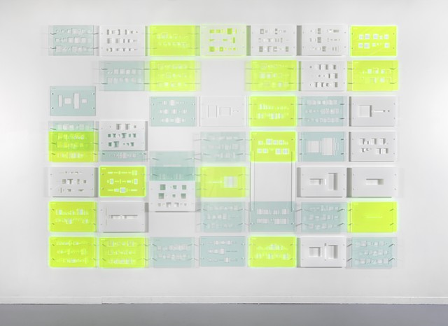 Green, blue, and white laser-cut acrylic template grid installation based on pi by Yvette Kaiser Smith