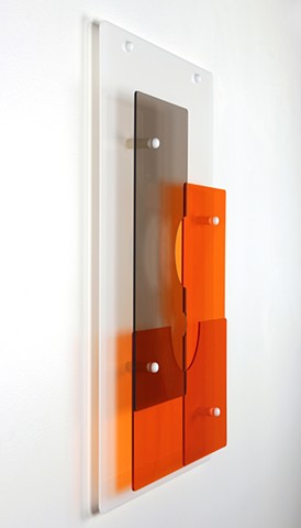 Geometric abstraction in laser-cut acrylic, white, brown, and orange based on pi by Yvette Kaiser Smith