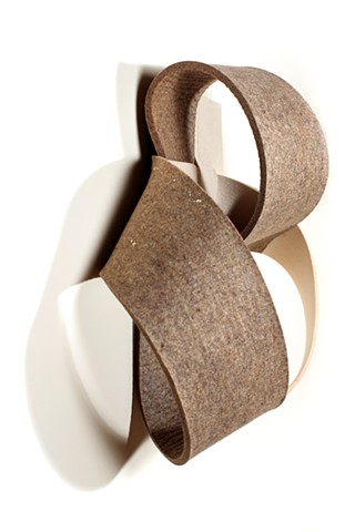 off-white and brown felt straps looped together