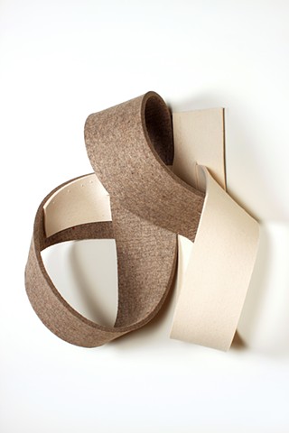 off-white and brown felt straps looped together