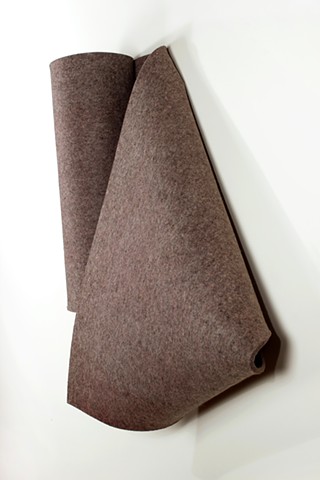 Simple folded 3D form in warm grey industrial felt