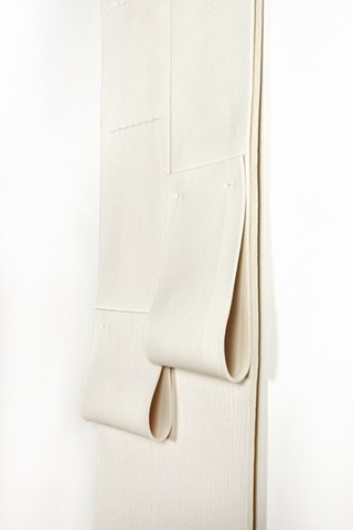 Off white vertical geometric composition in industrial felt with two tear drops created by folded felt straps