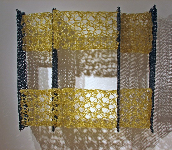 Minimal geometric crocheted fiberglass and polyester resin wall sculpture based on Pi by Yvette Kaiser Smith