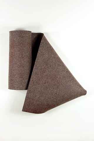 Simple folded 3D form in warm grey industrial felt