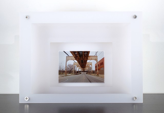 Digital pigment print on transparency film with laser-cut acrylic of urban setting by Yvette Kaiser Smith